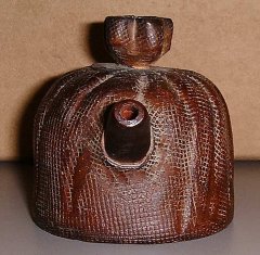 Clay tea pot which looks like a `meshed' screen. Clay tea pot which looks like a `meshed' screen.